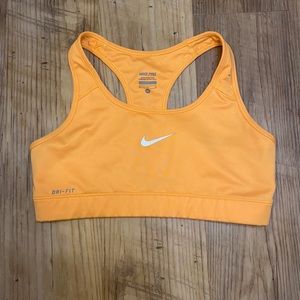 Women’s orange Nike sports bra